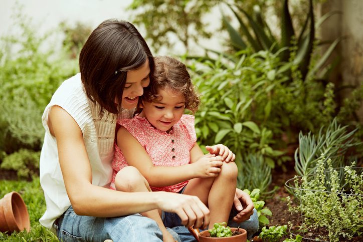 Lee's Nursery and Landscaping | Rock Hill, SC | mother and daughter planting in garden
